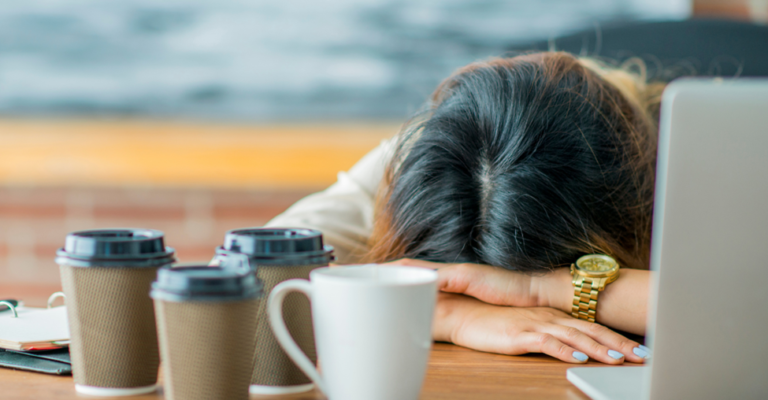 Lady with head lying on desk
